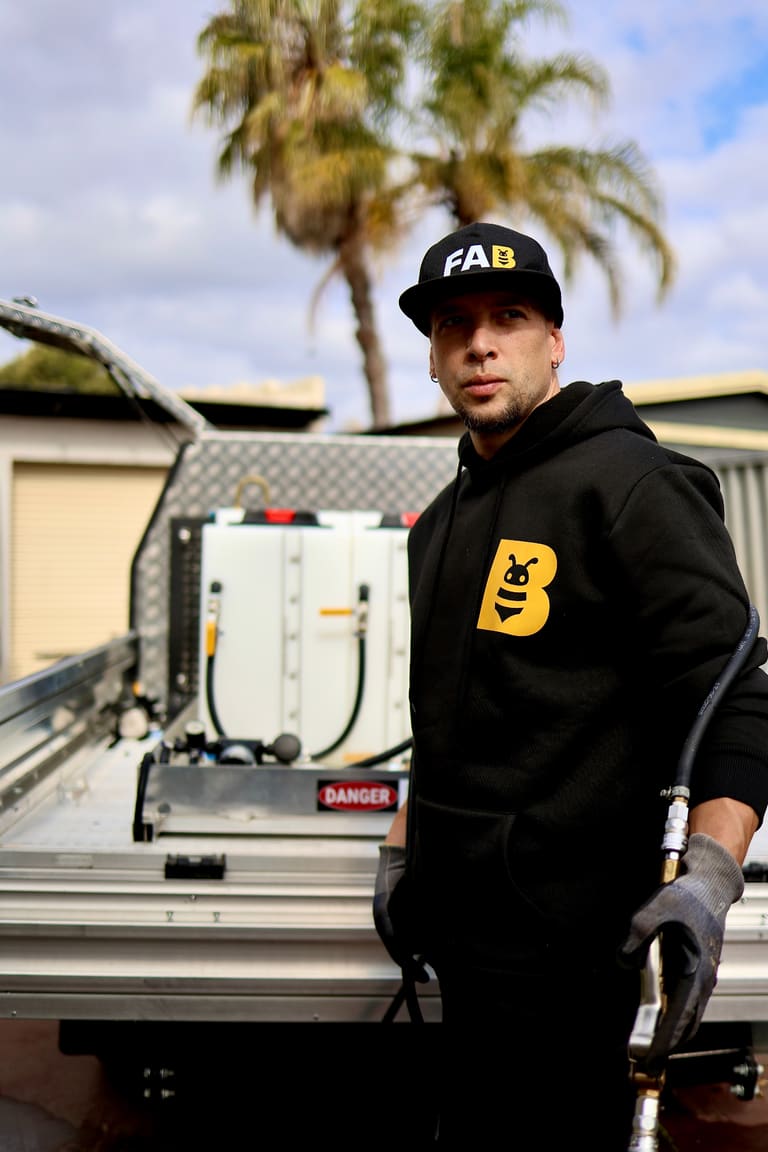 Fabien Maillot beside the FAB Pest Control service vehicle in Perth